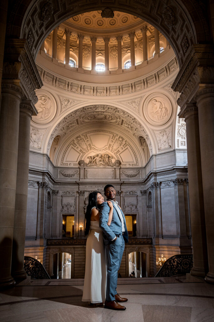 Bay Area wedding photography couple standing beneath the rotunda at San Francisco City Hall