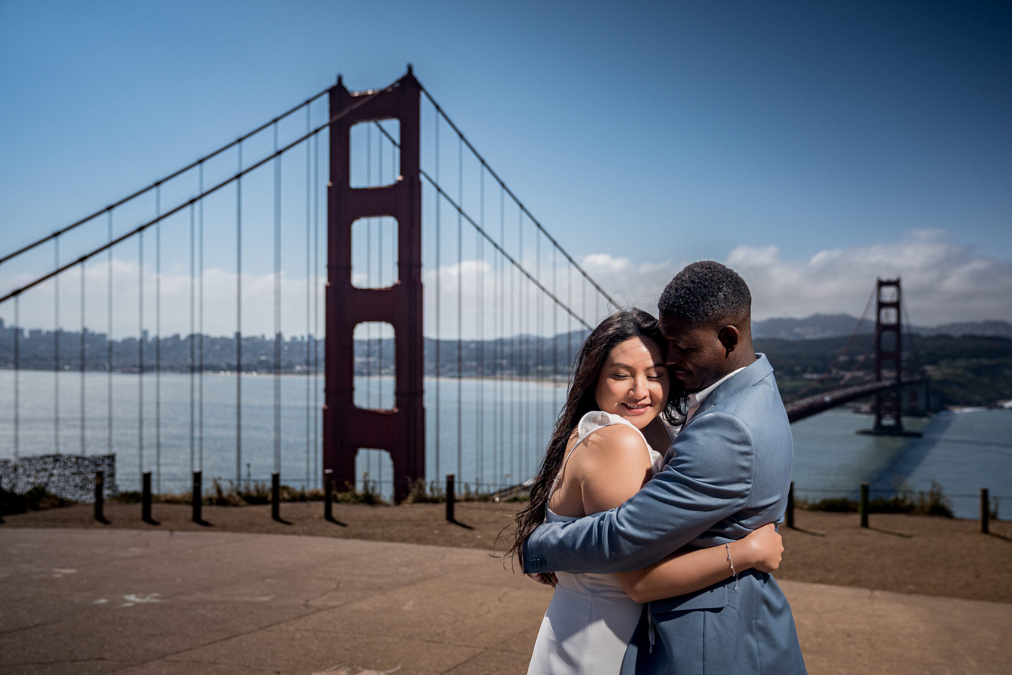Bay Area wedding photography couple embracing in front of the Golden Gate Bridge