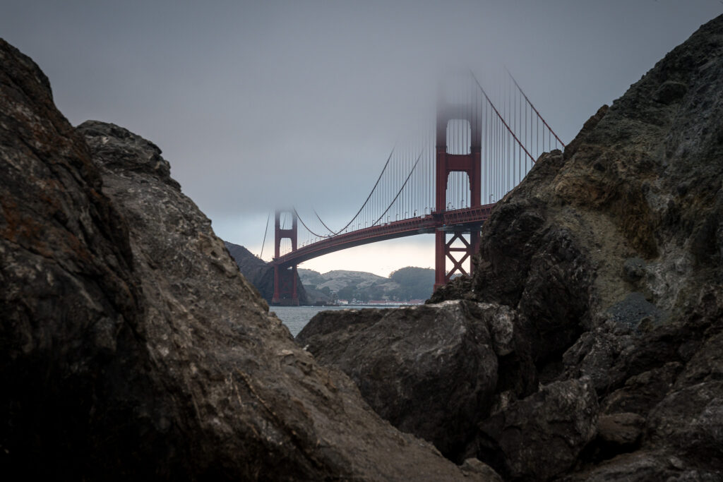 View of the Golden Gate Bridge from the rocky shoreline at Marshall's Beach